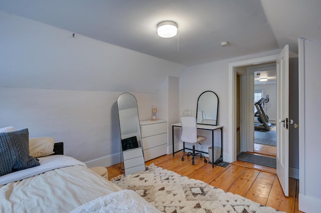917 Main St, Fryeburg, ME 04037 - bedroom with vaulted ceiling, light wood-style floors, and baseboards