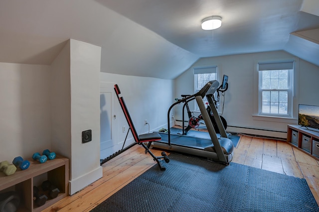 917 Main St, Fryeburg, ME 04037 - exercise area featuring wood-type flooring, a baseboard radiator, and vaulted ceiling
