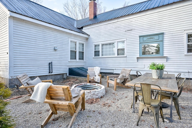 917 Main St, Fryeburg, ME 04037 - view of patio featuring an outdoor fire pit and outdoor dining space