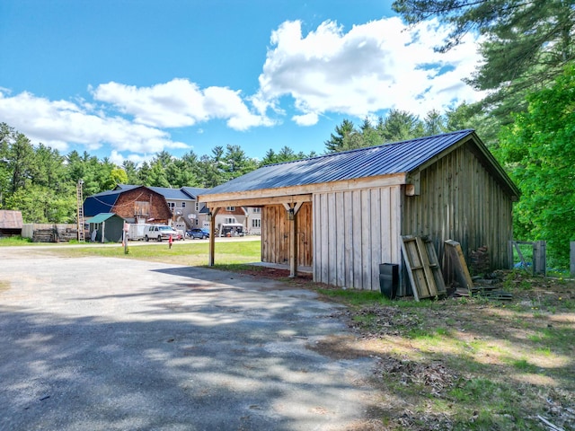 917 Main St, Fryeburg, ME 04037 - view of outbuilding with a carport and driveway