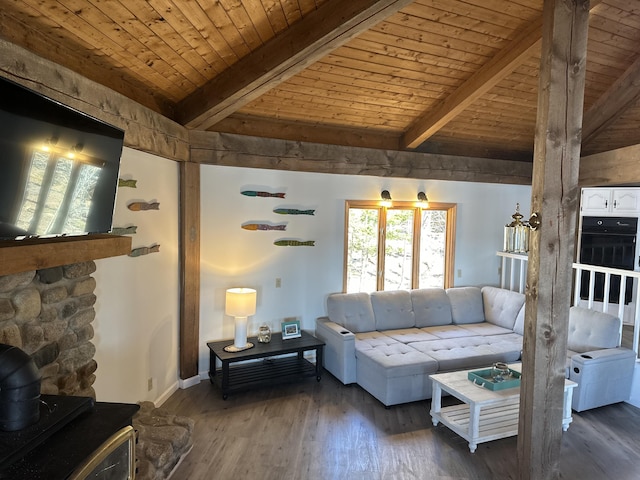 93 Goods Point Rd, Steuben, ME 04680 - living room with wood ceiling, wood finished floors, lofted ceiling with beams, baseboards, and a wood stove