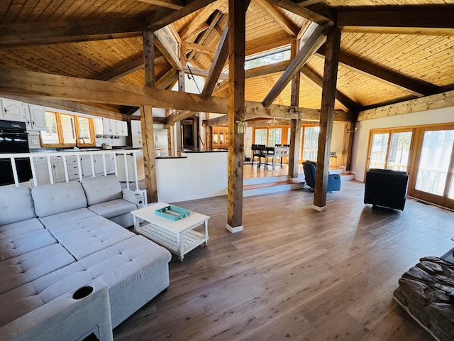 93 Goods Point Rd, Steuben, ME 04680 - living room with wooden ceiling, wood finished floors, beamed ceiling, and high vaulted ceiling