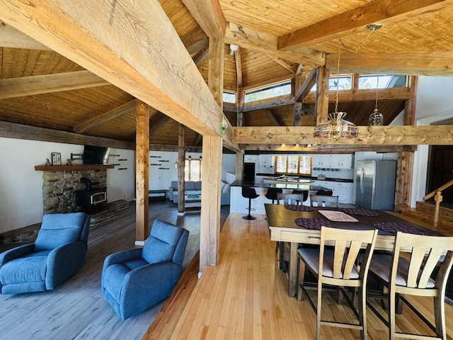 93 Goods Point Rd, Steuben, ME 04680 - living room with hardwood / wood-style floors, high vaulted ceiling, beamed ceiling, wood ceiling, and a notable chandelier