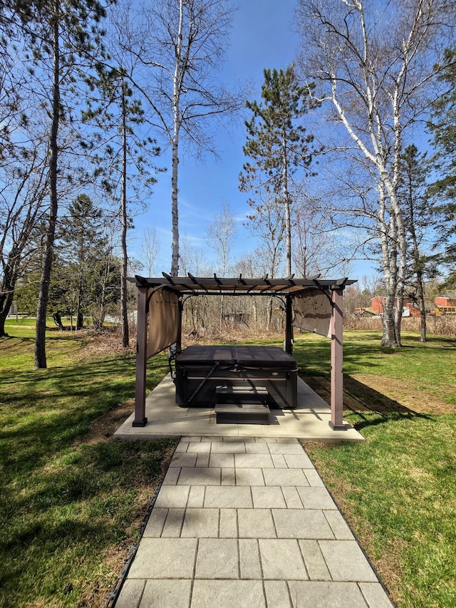 view of home's community with a yard and a hot tub