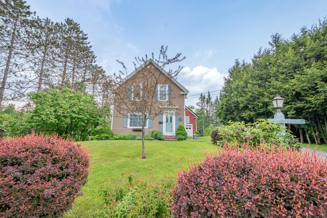 13 Park St, Dover-Foxcroft, ME 04426 - traditional-style home featuring a front lawn and entry steps