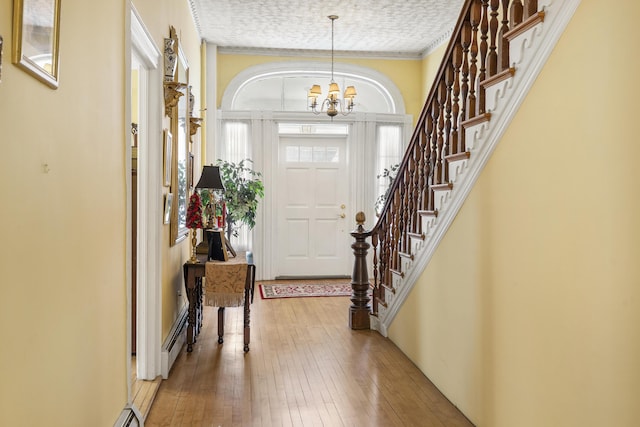 103 S St, Bath, ME 04530 - foyer featuring stairs, hardwood / wood-style floors, and a chandelier