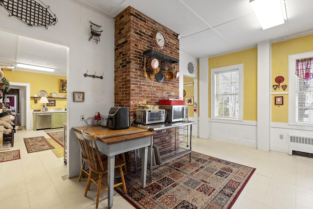 103 S St, Bath, ME 04530 - interior space featuring a toaster, tile patterned flooring, radiator heating unit, and a healthy amount of sunlight
