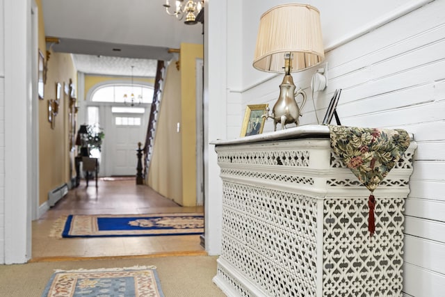 103 S St, Bath, ME 04530 - entryway with a notable chandelier and a baseboard radiator
