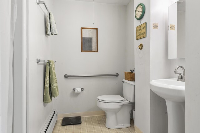 103 S St, Bath, ME 04530 - bathroom with tile patterned floors, a baseboard heating unit, toilet, a sink, and baseboards