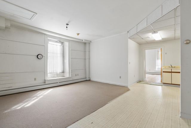 103 S St, Bath, ME 04530 - empty room with a baseboard heating unit, a sink, baseboard heating, and baseboards