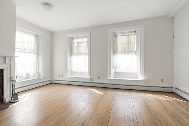 103 S St, Bath, ME 04530 - unfurnished living room featuring a brick fireplace and hardwood / wood-style flooring