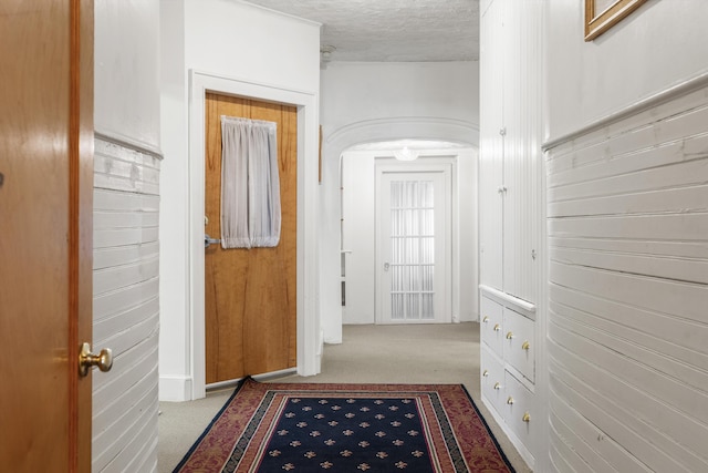 103 S St, Bath, ME 04530 - hall with arched walkways, a textured ceiling, and carpet floors