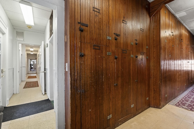 103 S St, Bath, ME 04530 - hall with wood walls and tile patterned floors