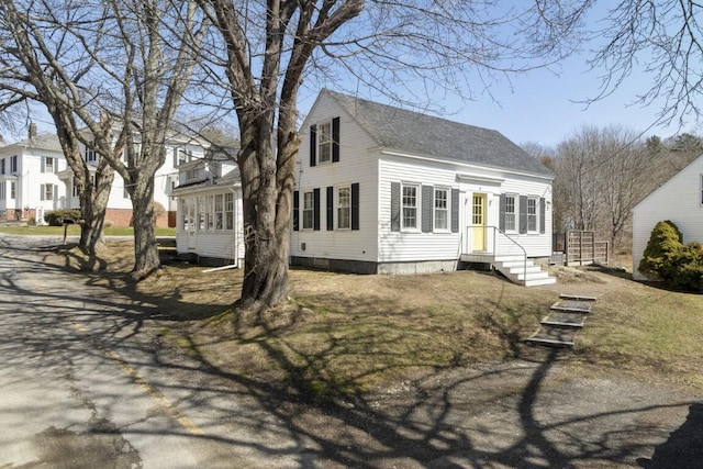 9 School St, Boothbay Harbor, ME 04538 - rear view of property with roof with shingles