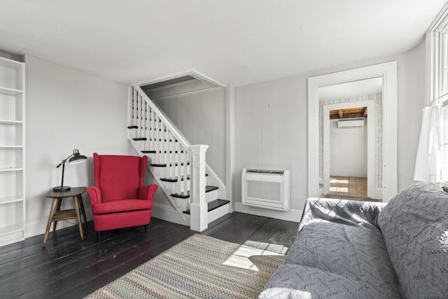 9 School St, Boothbay Harbor, ME 04538 - interior space featuring an AC wall unit, stairs, a wall mounted air conditioner, wood-type flooring, and baseboards