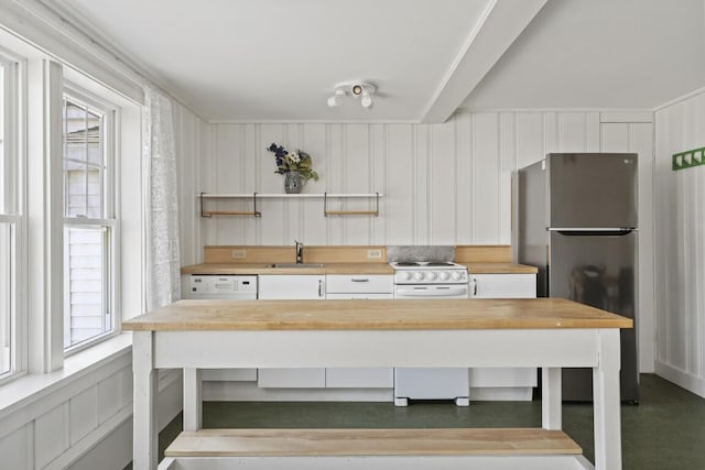9 School St, Boothbay Harbor, ME 04538 - interior space with open shelves, a sink, freestanding refrigerator, white electric stove, and wood counters