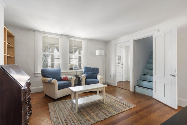 9 School St, Boothbay Harbor, ME 04538 - sitting room with baseboards, wood finished floors, and stairs