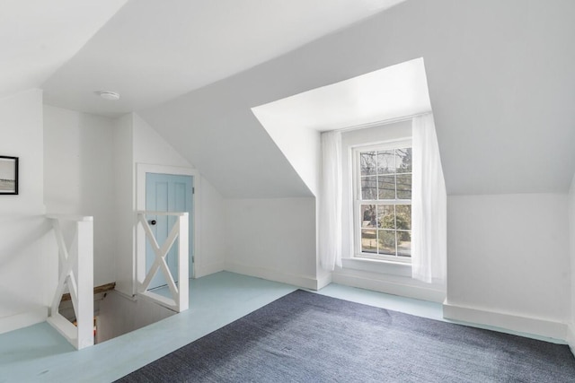9 School St, Boothbay Harbor, ME 04538 - additional living space with carpet floors, baseboards, and vaulted ceiling