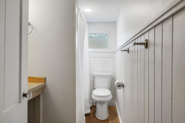 9 School St, Boothbay Harbor, ME 04538 - full bathroom with toilet, wood finished floors, and a shower with curtain
