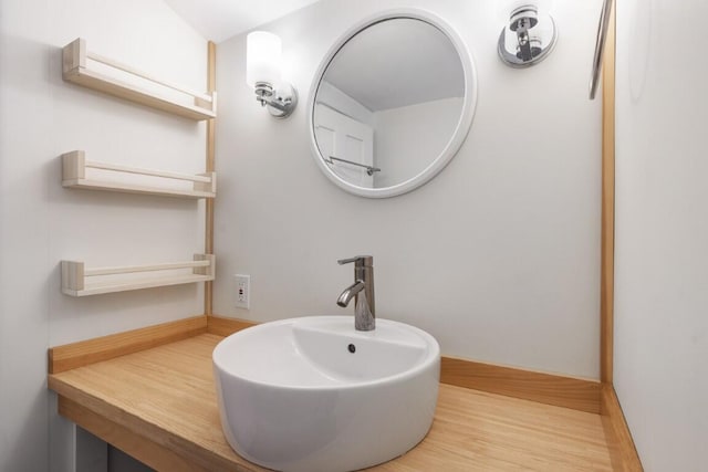 9 School St, Boothbay Harbor, ME 04538 - bathroom featuring a sink and wood finished floors
