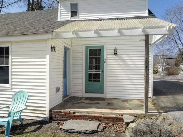 9 School St, Boothbay Harbor, ME 04538 - property entrance featuring metal roof