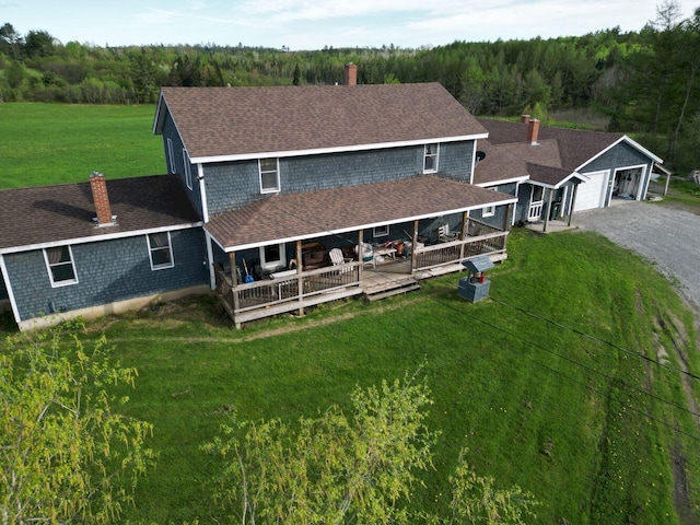 15 Murphy Ln, Madison, ME 04950 - view of front facade with roof with shingles, a garage, and a front yard