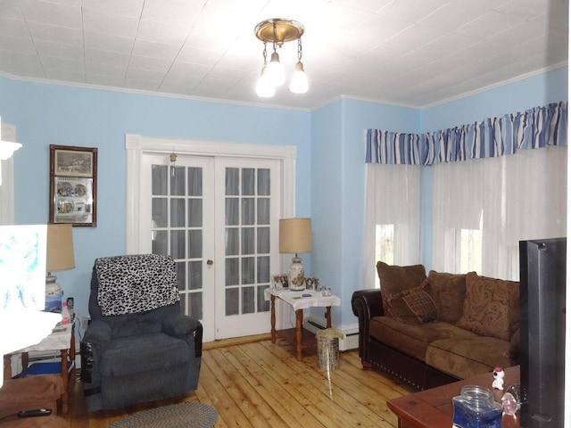 16 Pleasant St, Milo, ME 04463 - living room featuring crown molding, french doors, and wood-type flooring