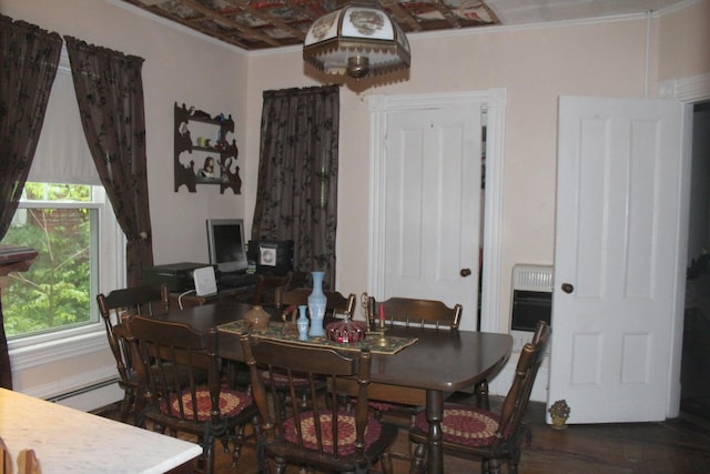 16 Pleasant St, Milo, ME 04463 - dining area with crown molding, heating unit, wood finished floors, and baseboard heating