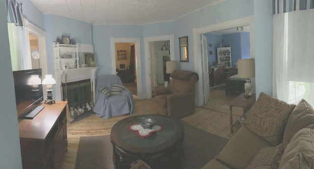 16 Pleasant St, Milo, ME 04463 - living area with a fireplace and wood finished floors