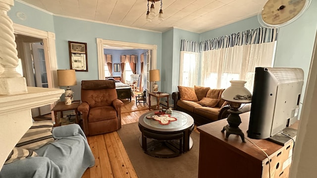 16 Pleasant St, Milo, ME 04463 - living area featuring hardwood / wood-style flooring and crown molding