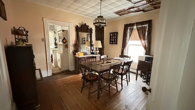 16 Pleasant St, Milo, ME 04463 - dining area with a chandelier, an ornate ceiling, and dark wood finished floors