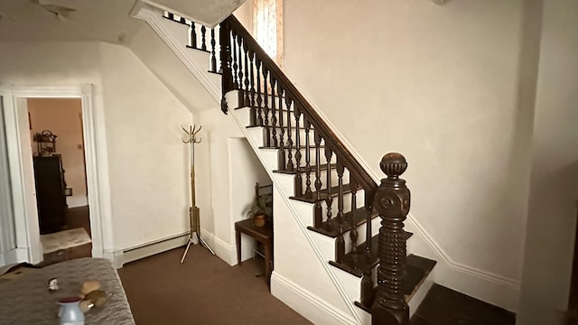 16 Pleasant St, Milo, ME 04463 - stairway with baseboards, carpet, and baseboard heating