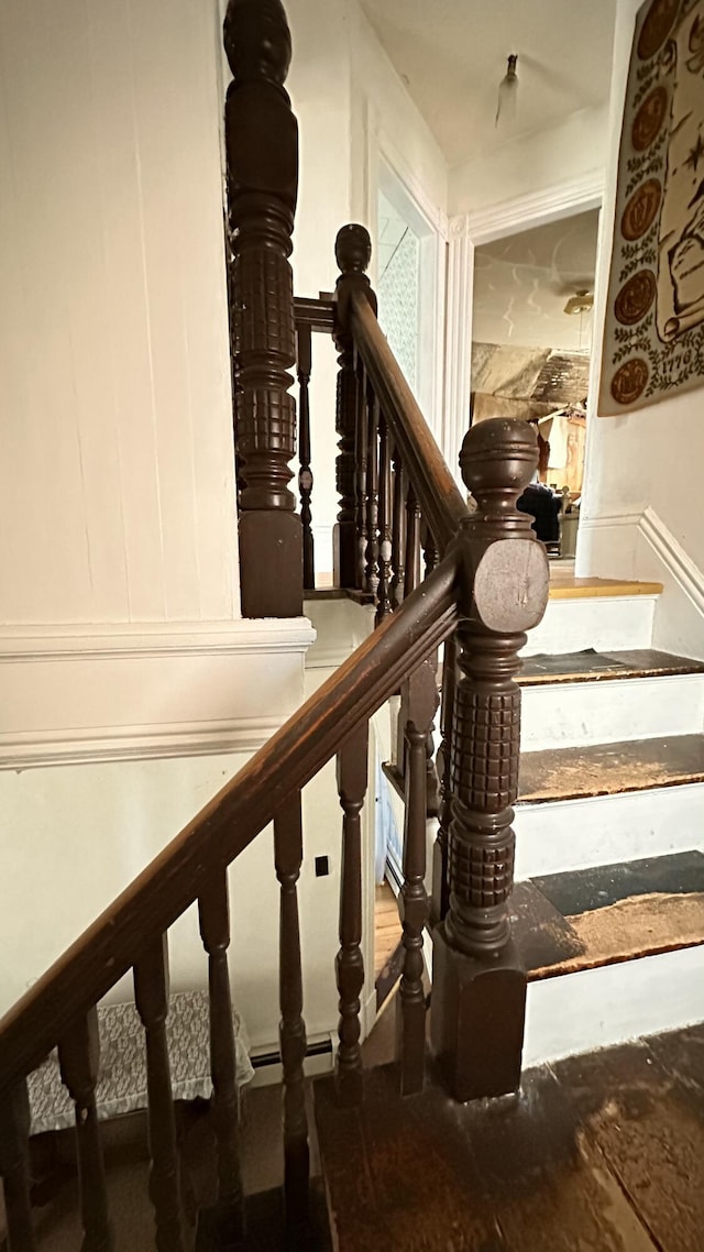 16 Pleasant St, Milo, ME 04463 - stairway with a decorative wall and a wainscoted wall