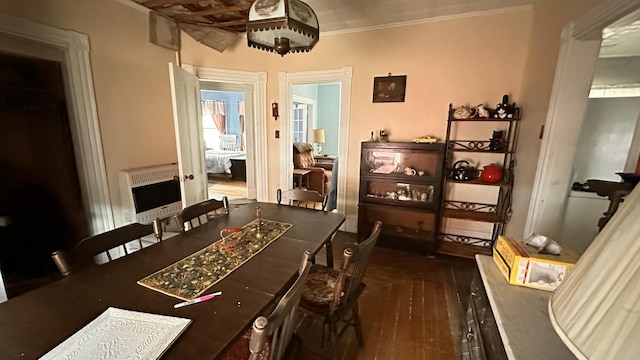 16 Pleasant St, Milo, ME 04463 - dining room featuring crown molding, wood finished floors, and heating unit