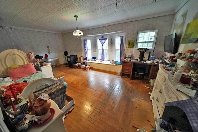 84 Military St, Houlton, ME 04730 - bedroom with wallpapered walls, ornamental molding, multiple windows, wood-type flooring, and a desk