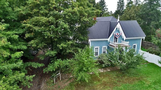 84 Military St, Houlton, ME 04730 - view of side of home with fence and metal roof