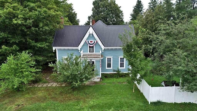 84 Military St, Houlton, ME 04730 - view of front facade with a chimney and metal roof