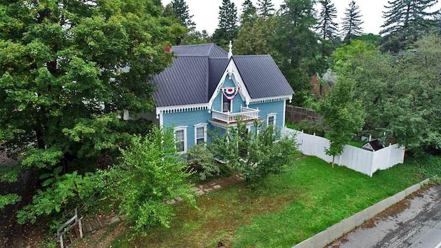 84 Military St, Houlton, ME 04730 - view of front facade featuring fence and metal roof