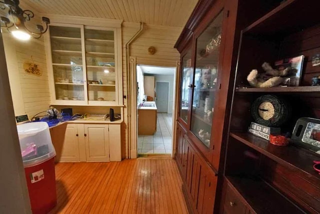 84 Military St, Houlton, ME 04730 - bar area featuring wooden walls, light wood-style flooring, and wooden ceiling