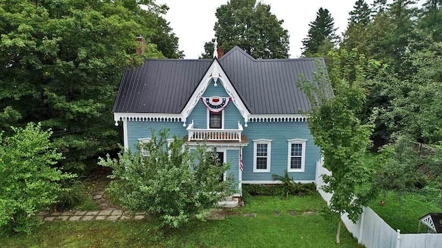 84 Military St, Houlton, ME 04730 - view of front of home with a chimney and metal roof