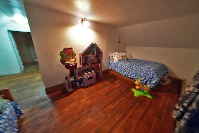 84 Military St, Houlton, ME 04730 - bedroom featuring vaulted ceiling and wood finished floors