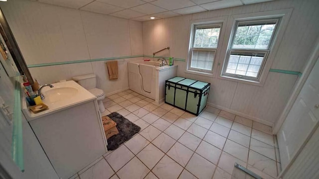 84 Military St, Houlton, ME 04730 - full bath featuring vanity, toilet, tile patterned flooring, and baseboards