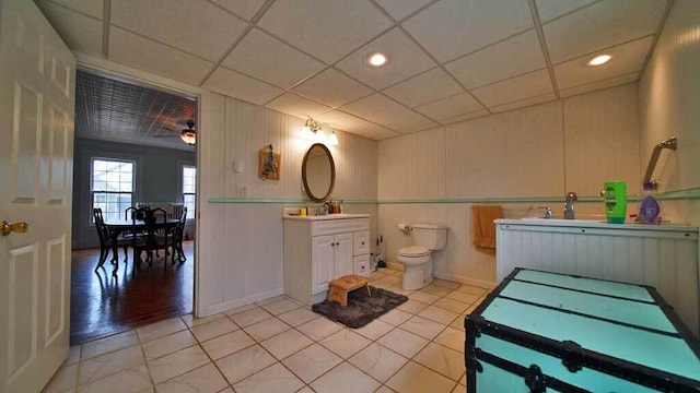 84 Military St, Houlton, ME 04730 - bathroom with toilet, vanity, a drop ceiling, tile patterned flooring, and a ceiling fan