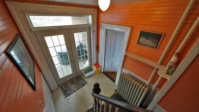 84 Military St, Houlton, ME 04730 - entryway with wooden walls and carpet