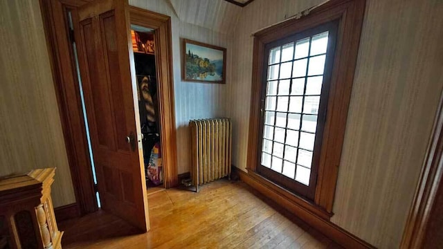84 Military St, Houlton, ME 04730 - entryway with radiator, light wood finished floors, healthy amount of natural light, and wallpapered walls