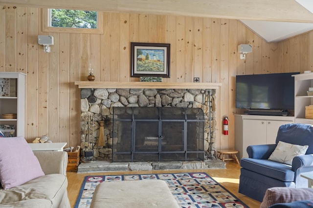 223 Pemaquid Trl, Bristol, ME 04554 - living room featuring wooden walls, a fireplace, and vaulted ceiling