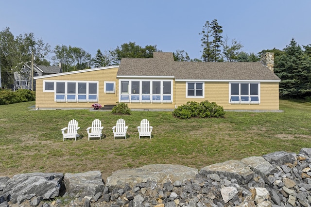 223 Pemaquid Trl, Bristol, ME 04554 - back of house featuring a lawn, a chimney, and roof with shingles