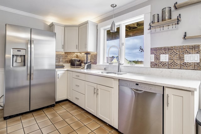 kitchen featuring a sink, light tile patterned flooring, pendant lighting, decorative backsplash, and appliances with stainless steel finishes