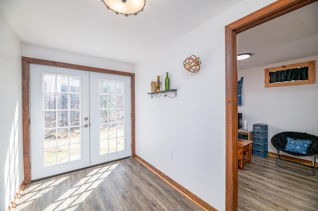 575 Hallowell Rd, Chelsea, ME 04330 - entryway featuring french doors, wood finished floors, and baseboards