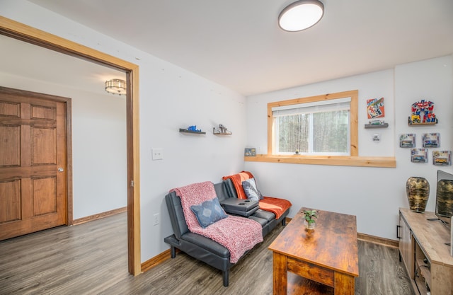 575 Hallowell Rd, Chelsea, ME 04330 - sitting room with wood finished floors and baseboards